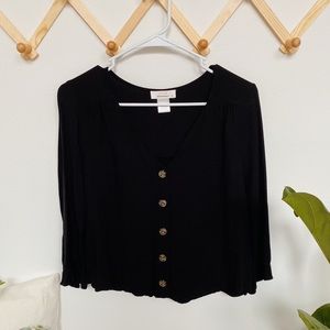 long sleeved black button up blouse